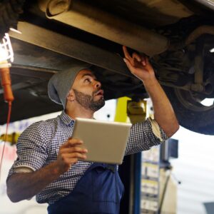 img of someone inspecting a car