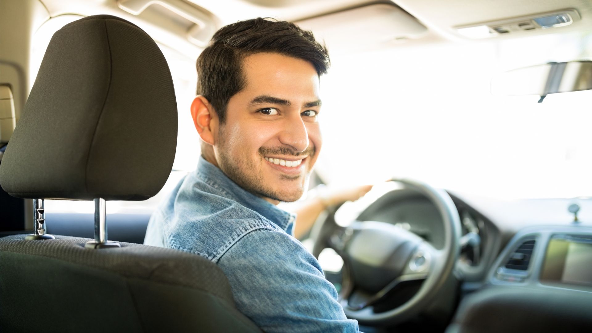 man driving car