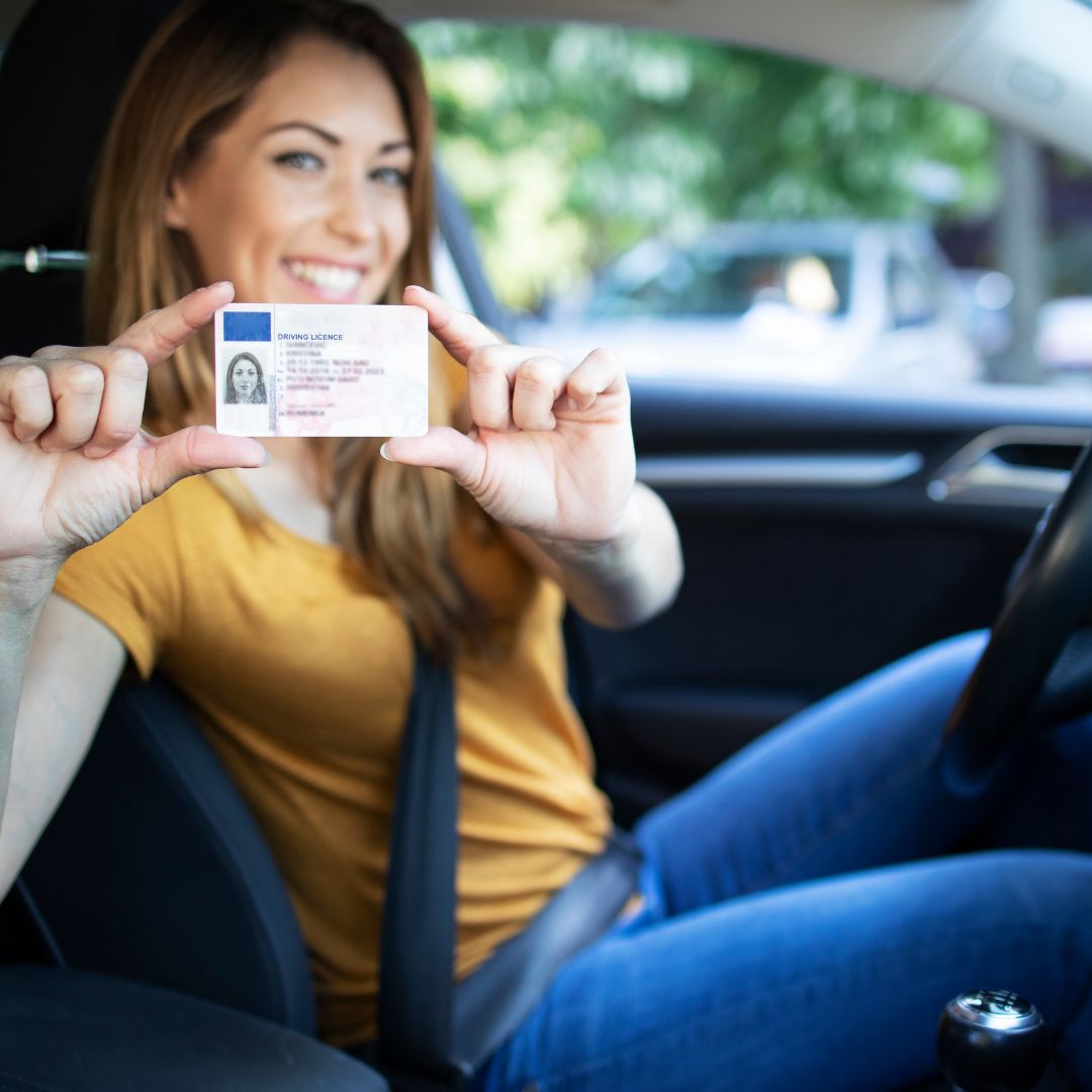 Woman holding new license