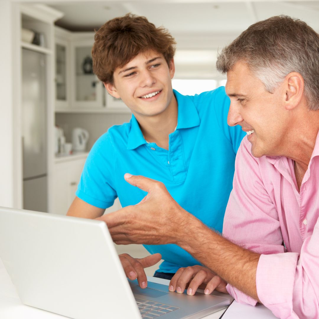 Father and son on laptop