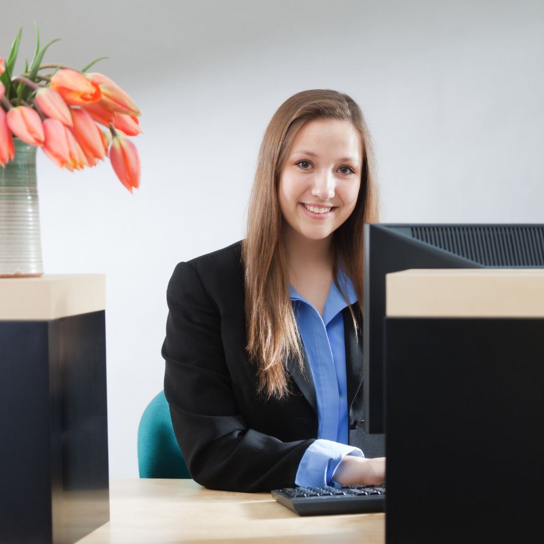 professional woman sitting at desk