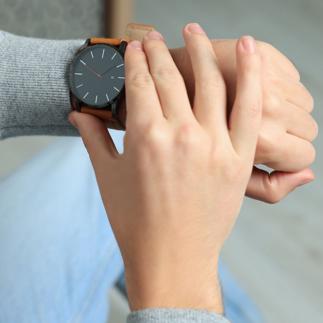 Person checking their watch. 