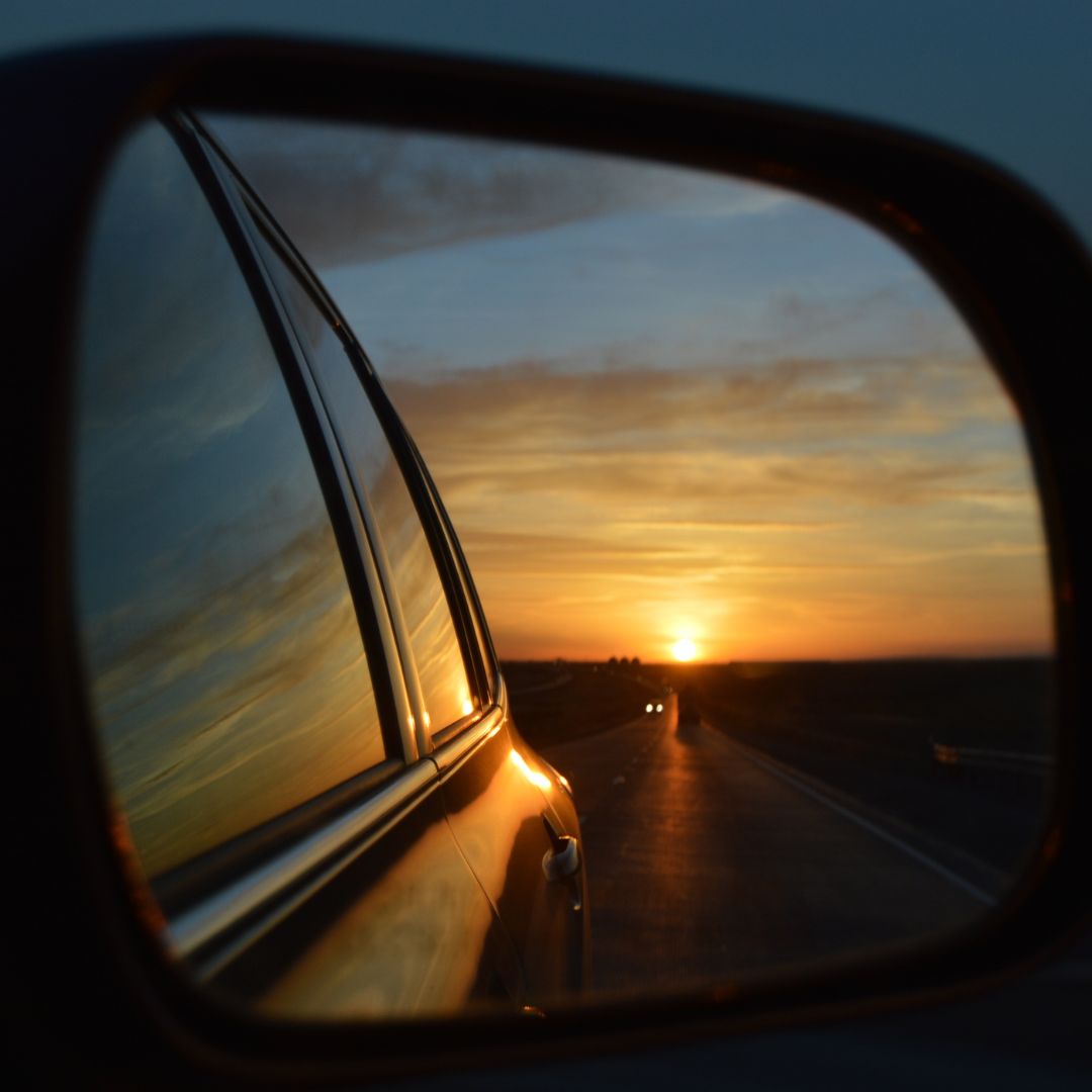 View of the sunset in a side mirror