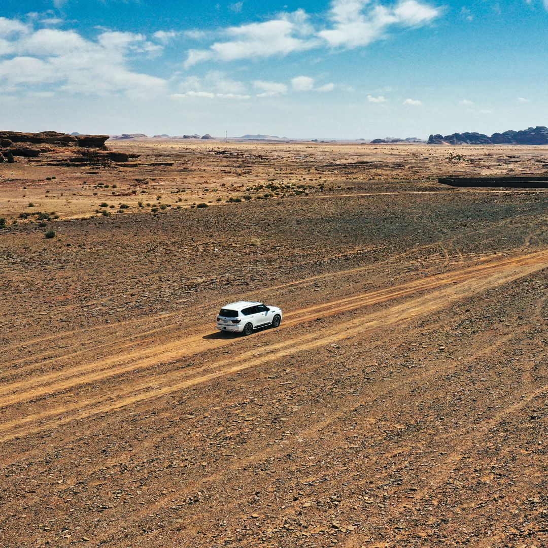 Car driving through the desert