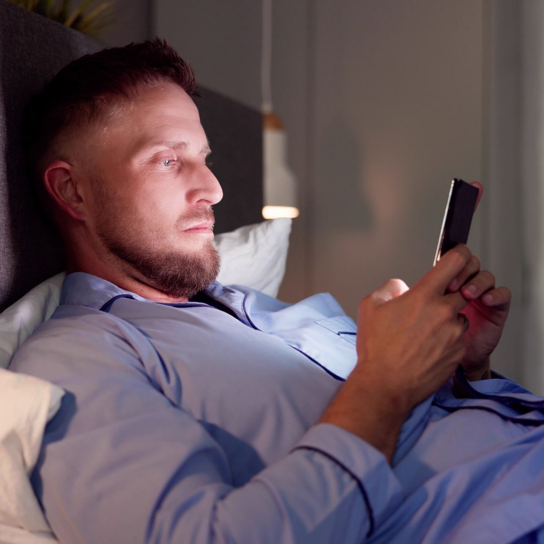 Man looking at smartphone screen